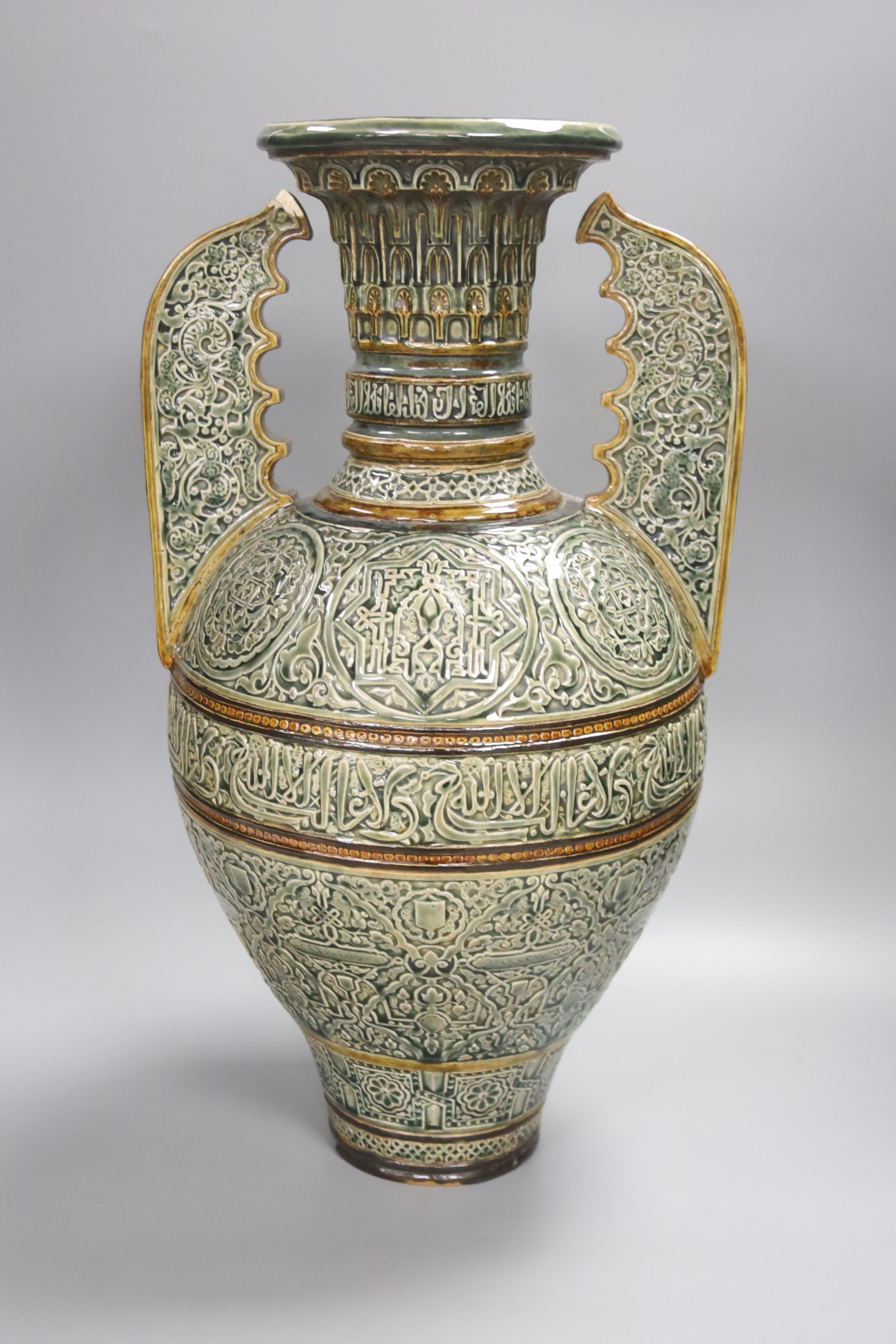 A large Doulton Lambeth Islamic inspired two handled glazed stoneware vase, dated 1880, 47cm, repairs